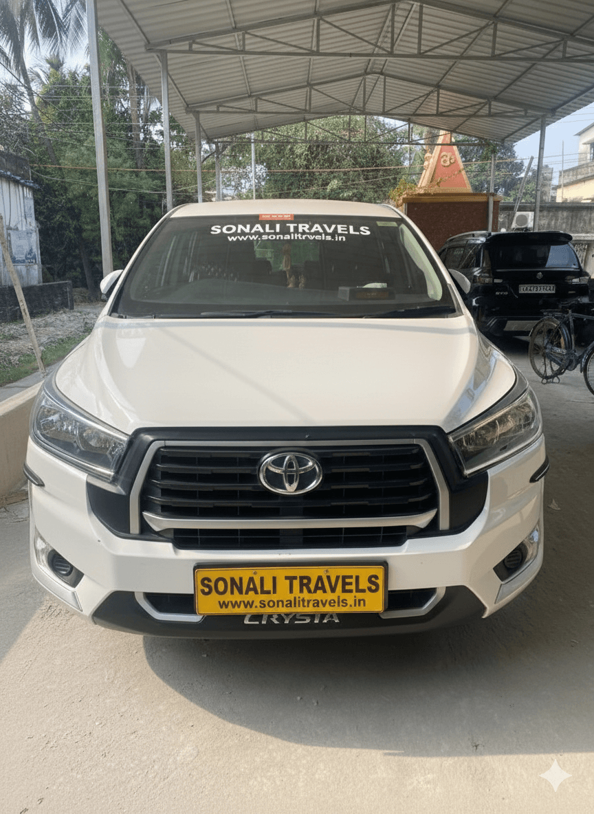 सोनाली ट्रेवल्स की सफेद टोयोटा इनोवा क्रिस्टा कार एक शेड के नीचे खड़ी है।